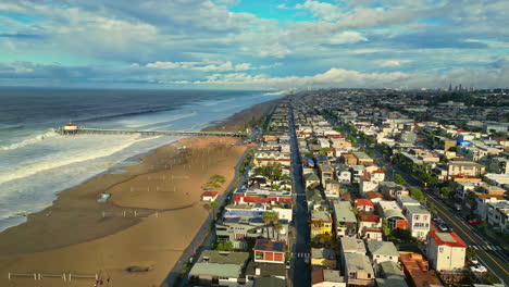 Aerial-panning-view-of-colorful-sunset-over-Manhattan-Beach-in-Los-Angeles