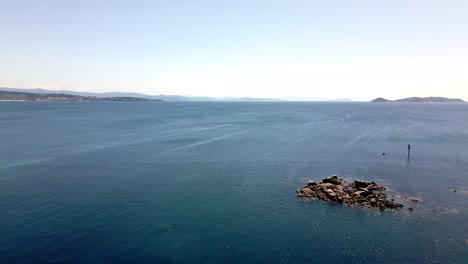 Aerial-Footage-of-Peaceful-Atlantic-with-Shore-and-Islands-in-Horizon