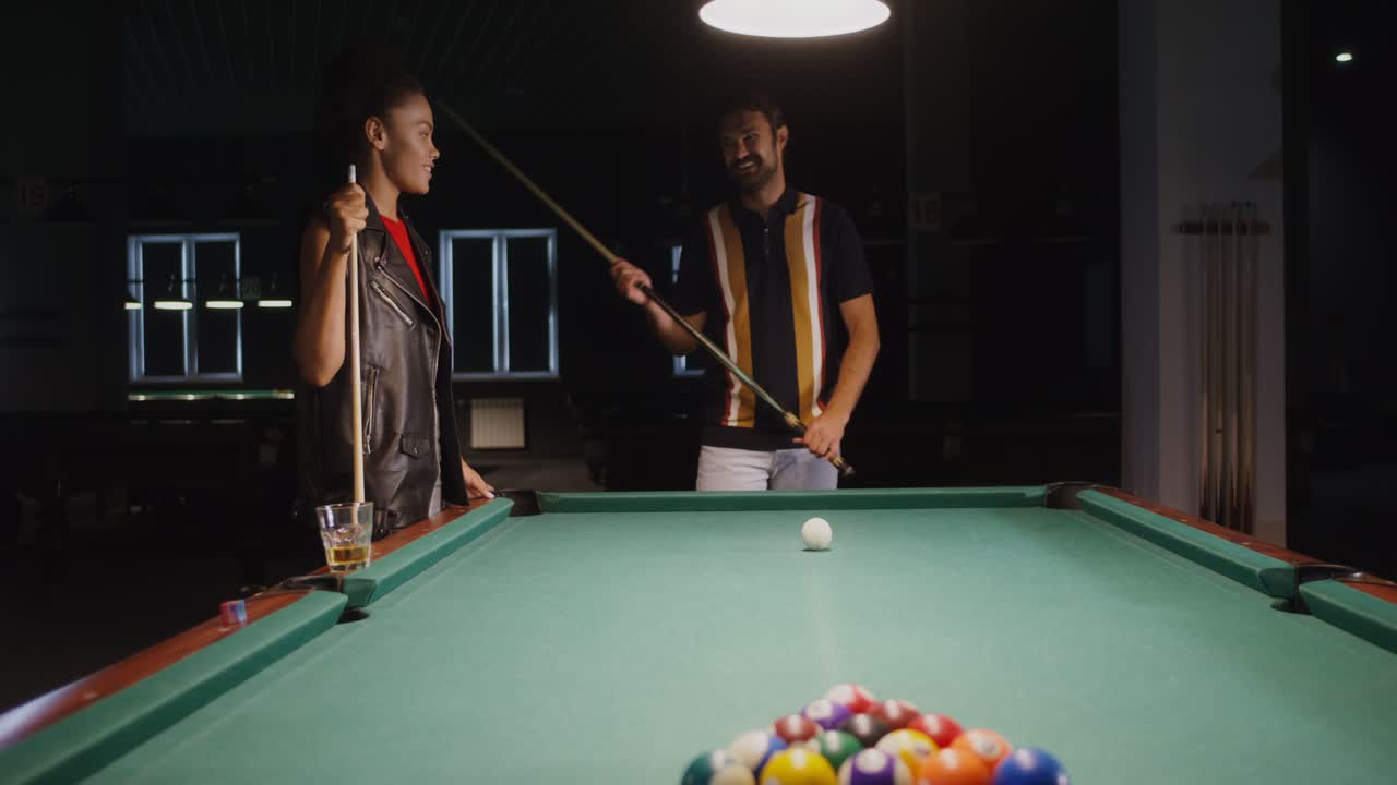 Couple Playing Pool in a Bar