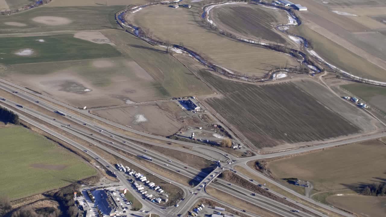 Aerial View Of Highway 1 Cutting Through Open Farmlands In Chilliwack, BC, Canada.