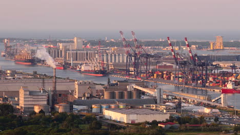 drone view of industrial and port area of ravenna,production district is made up of a chemical and petrochemical pole, thermoelectric and metallurgical plants at sunset