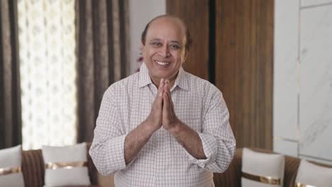 desi indian old uncle doing namaste and greetings