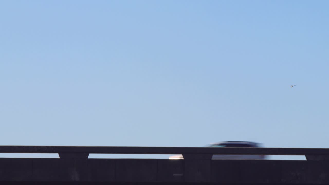 Blue social bubbles growing above bridge, vehicles passing raising counters and showing engagement
