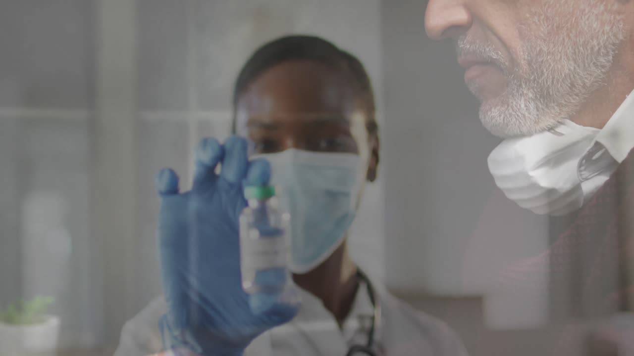 Animation of female doctor over senior man wearing face mask