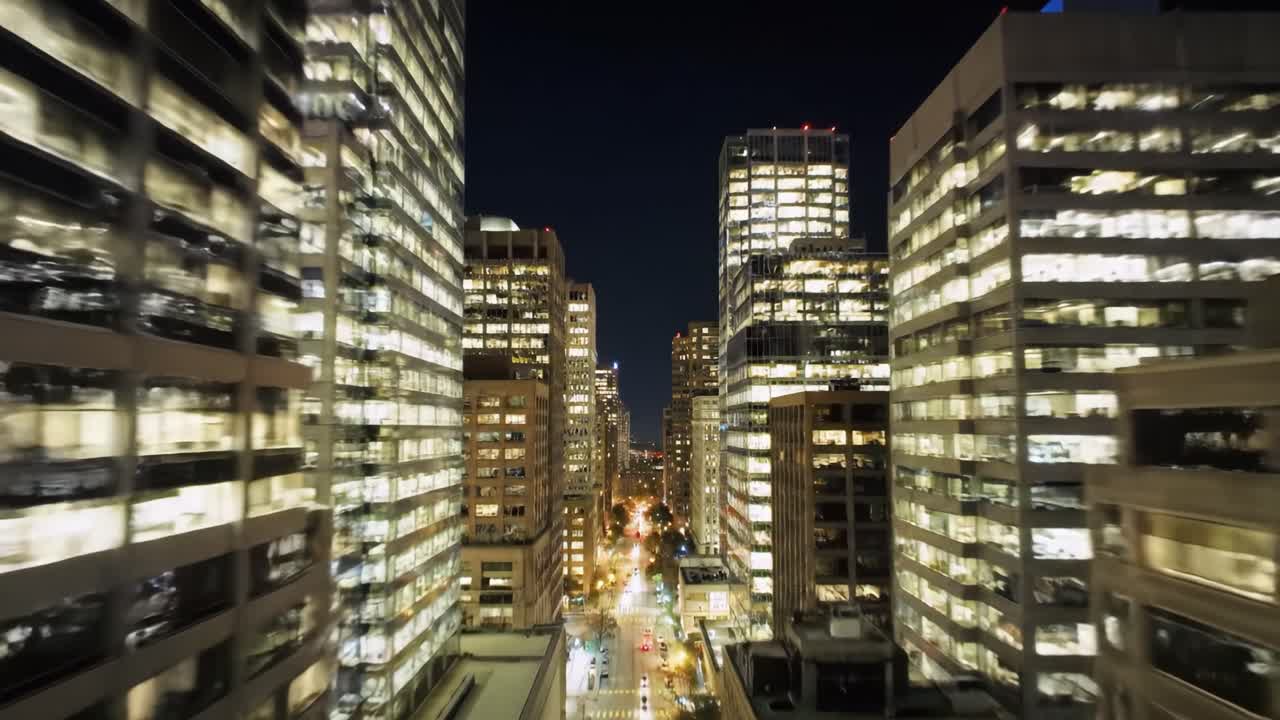 A Stunning Nighttime Urban Landscape Showcasing Illuminated Skyscrapers and Vibrant City Streets, Captured from Above to Highlight the Nightlife and Energy of the City