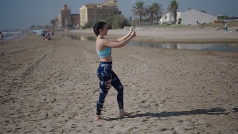 woman taking pictures on the beach