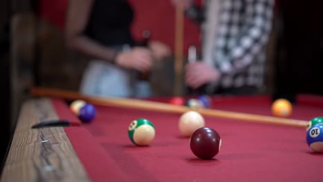 Unrecognizable-couple-spending-evening-in-billiard-club