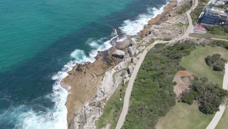 Aerial-View-Of-Bondi-to-Bronte-Coastal-Walk-At-Mackenzies-Point---Tamarama-And-Bronte-Beach-In-Sydney,-NSW,-Australia