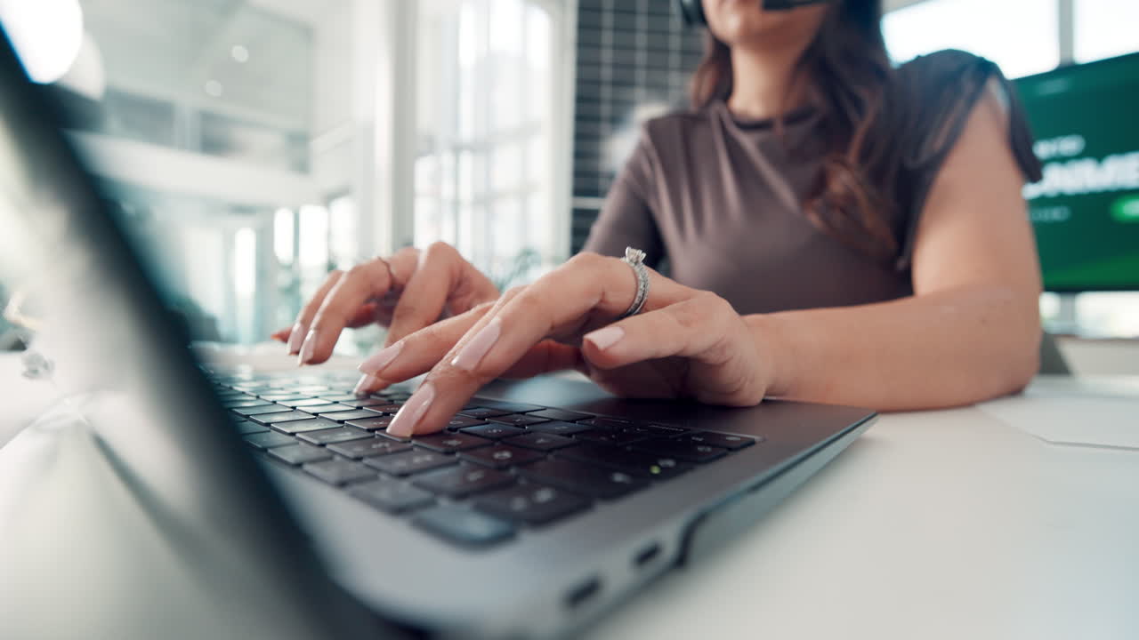 Close-Up of Woman's Hands Typing on Laptop Keyboard in Office