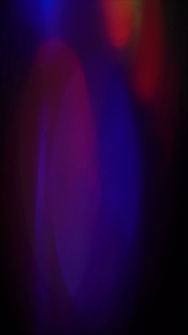 Abstract Colorful Light Leaks and Bokeh on Dark Background