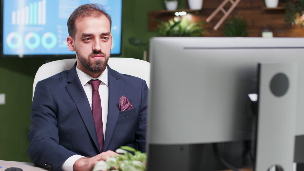 Businessman in office working on computer