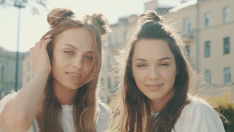 two happy women posing outdoors