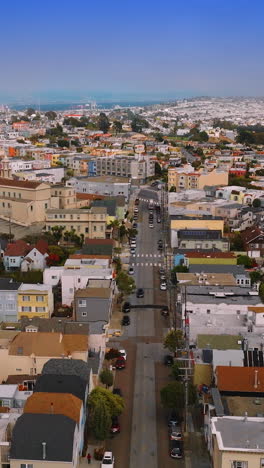 beautiful cozy streets and houses of bright san francisco, california, usa. sunny cityscape with hazy horizon at the backdrop of blue sky. vertical video