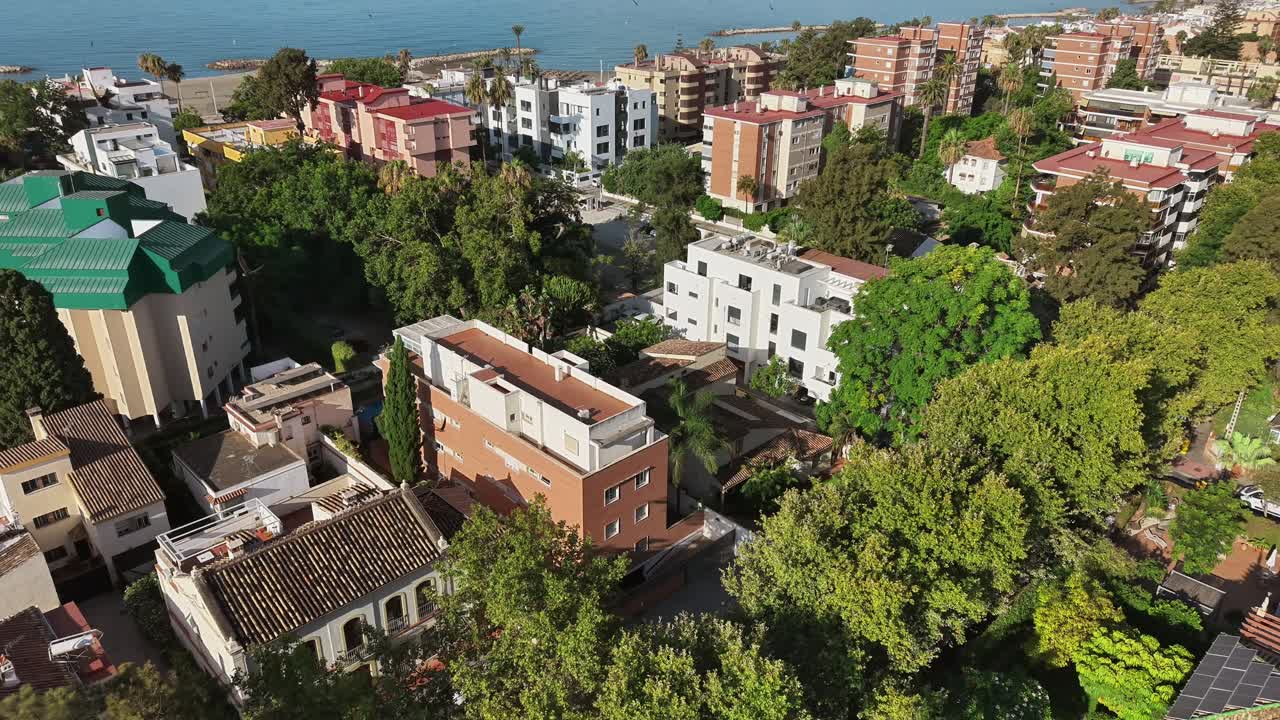 Peaceful time-lapse of brick houses in a quiet neighborhood surrounded by green trees and water