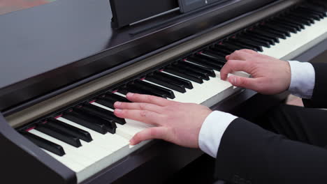 man playing digital piano