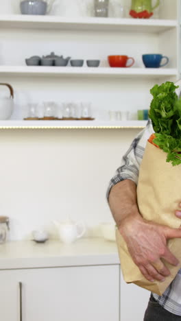 man carrying the groceries