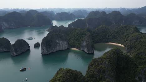 drone shot flying over epic islands in cat ba and halong bay in northern vietnam