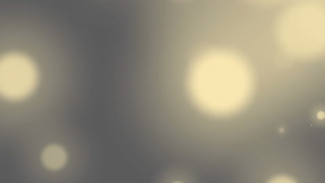 animation of falling spots of lights over grey background