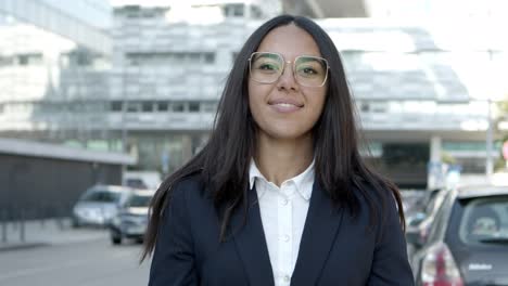 attractive young businesswoman smiling at camera