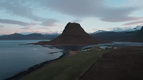 above kirkjufell: aerial majesty of iceland's iconic mountain on the snæfellsnes peninsula – drone views near grundarfjörður