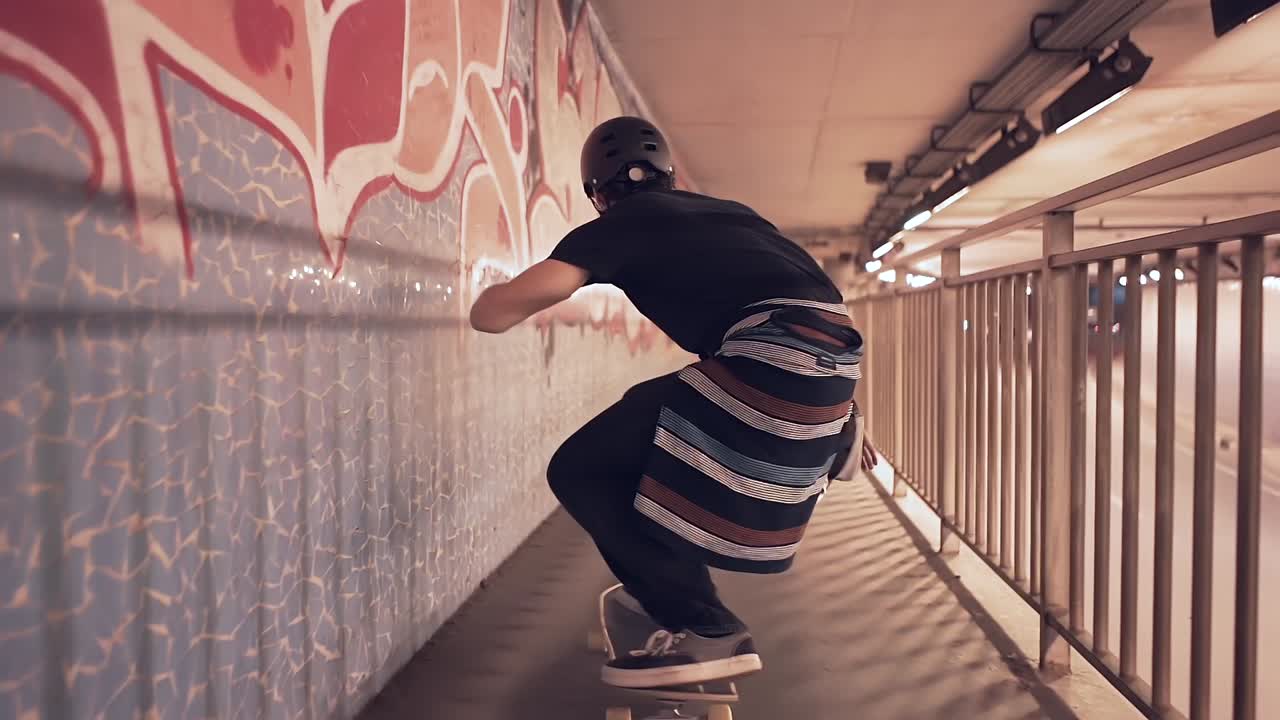 Skateboarder in an Urban Tunnel at Night
