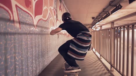 skateboarder in an urban tunnel at night