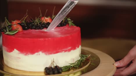 cutting a deliciously decorated cake