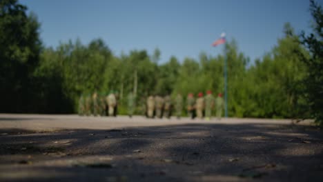 soldiers in the forest formation in blurred vision marching