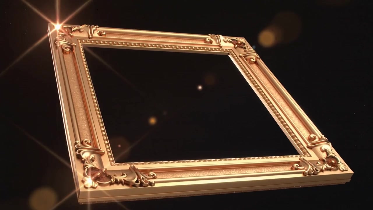 Camera tracking ornate gold frame rotating revealing rectangle at black void with flare and dust