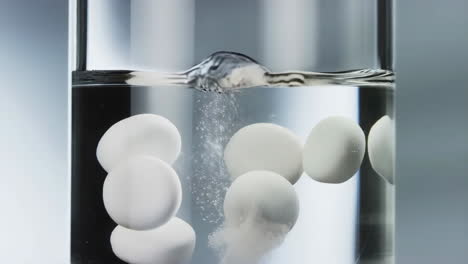 pills dissolving in water
