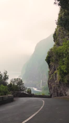 mountain road with waterfall view