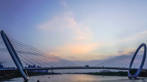 modern cable-stayed bridge over water at dusk