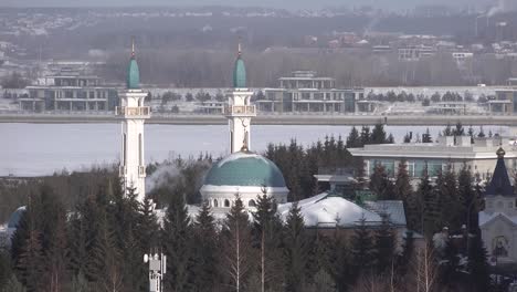 irek mosque kazan tatarstan. smoke from pipe. frozen river at winter background