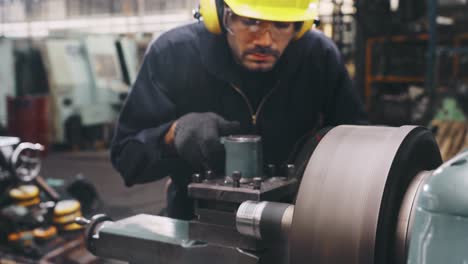 smart factory worker using machine in factory workshop