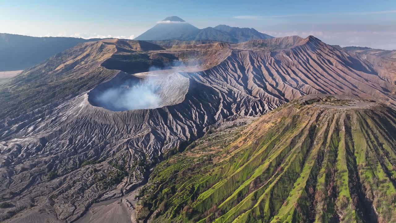 Impressive scene of active volcanos and craters. Drone flyover, Mount Bromo, Indonesia.