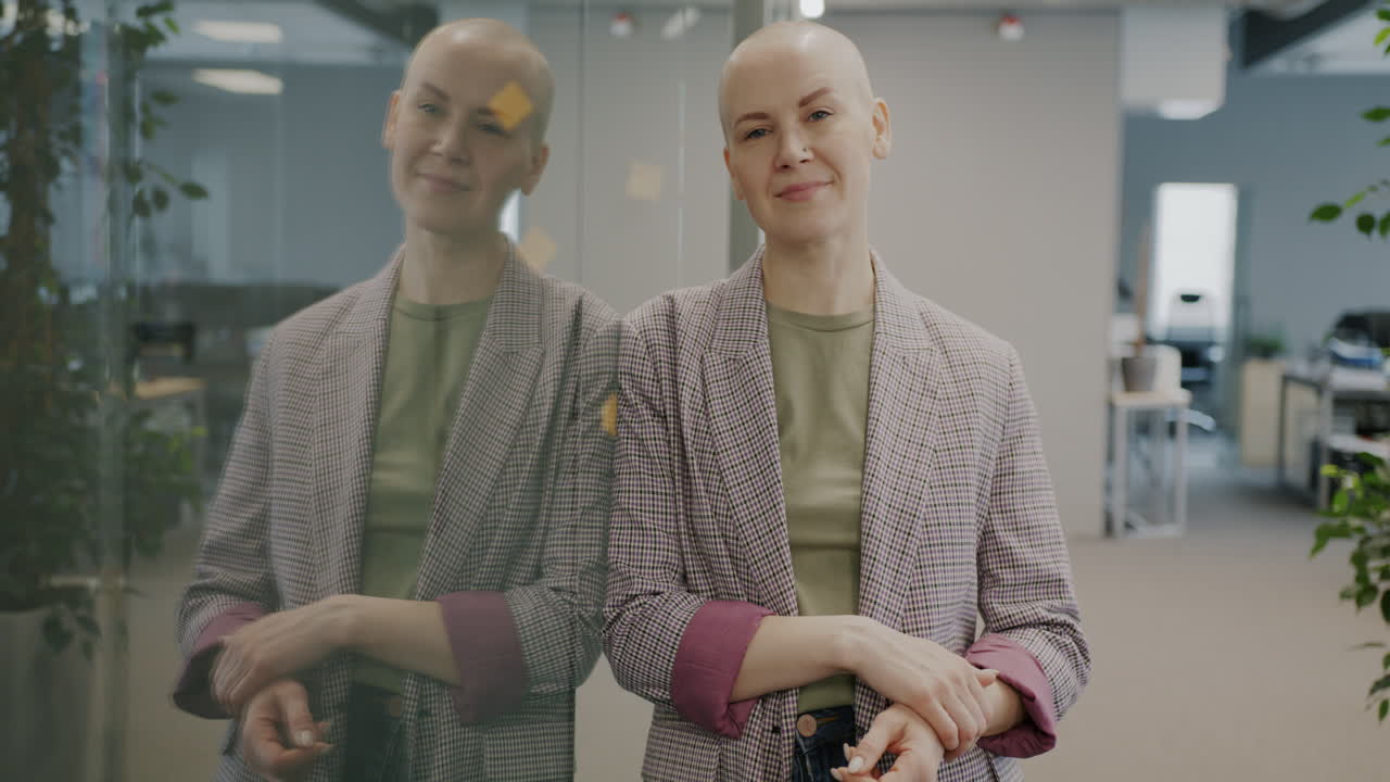 Confident Bald Woman in Modern Office