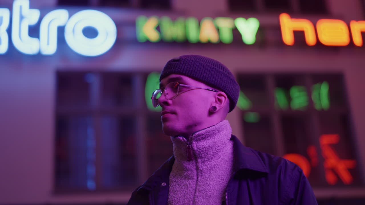 Man in neon city lights