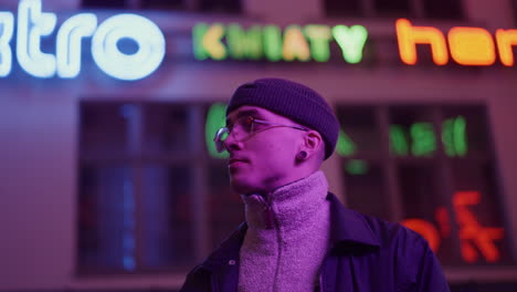 man in neon city lights