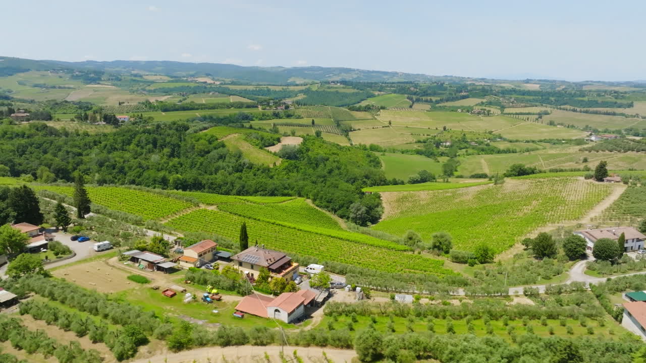 Panoramic drone shot of a RV driving in a Tuscan village, summer day in Italy