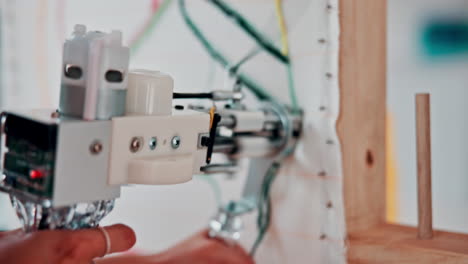 robot arm manipulating fabric in artistic installation