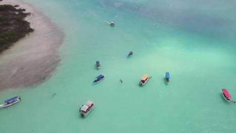 Lagoon-Bay-with-Tourist-Boats-in-Turquoise-Water,-Mexico-Aerial-Approach-View