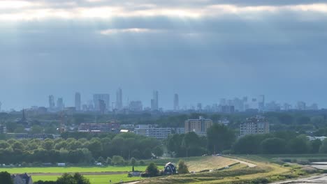 rotterdam skyline: sun rays piercing the clouds