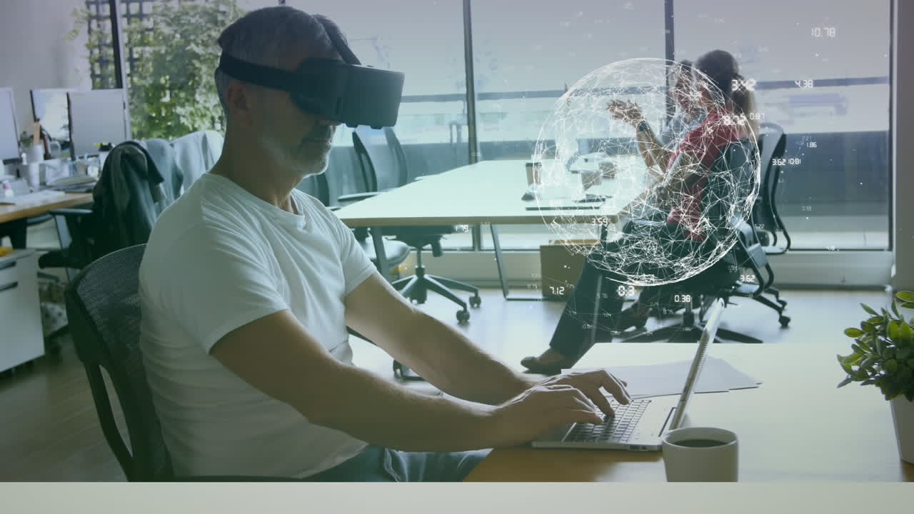 Man working on laptop with a virtual reality glasses