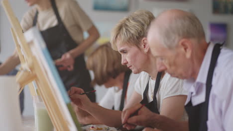 senior men and women learn to paint