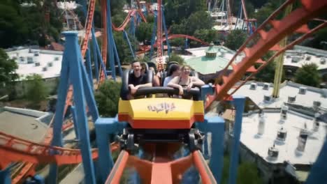 thrilling roller coaster ride captured in dynamic frames: an exciting journey through twists and turns for adventurous riders in amusement park settings