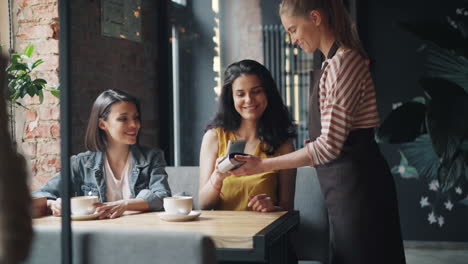 women friends enjoying coffee at a cafe