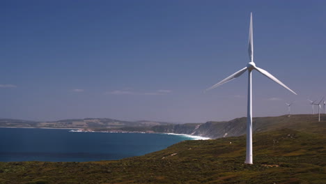 static shot of a windmill along the coast of australia