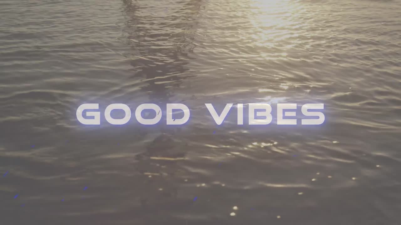 Animation of the words good vibes written in white letters over tranquil moving water