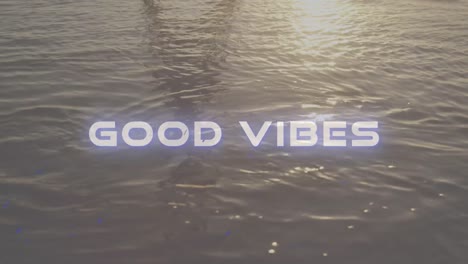 animación de las palabras buenas vibraciones escritas en letras blancas sobre agua en movimiento tranquila