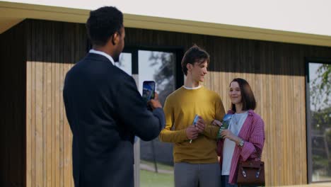 real estate couple viewing a modern house
